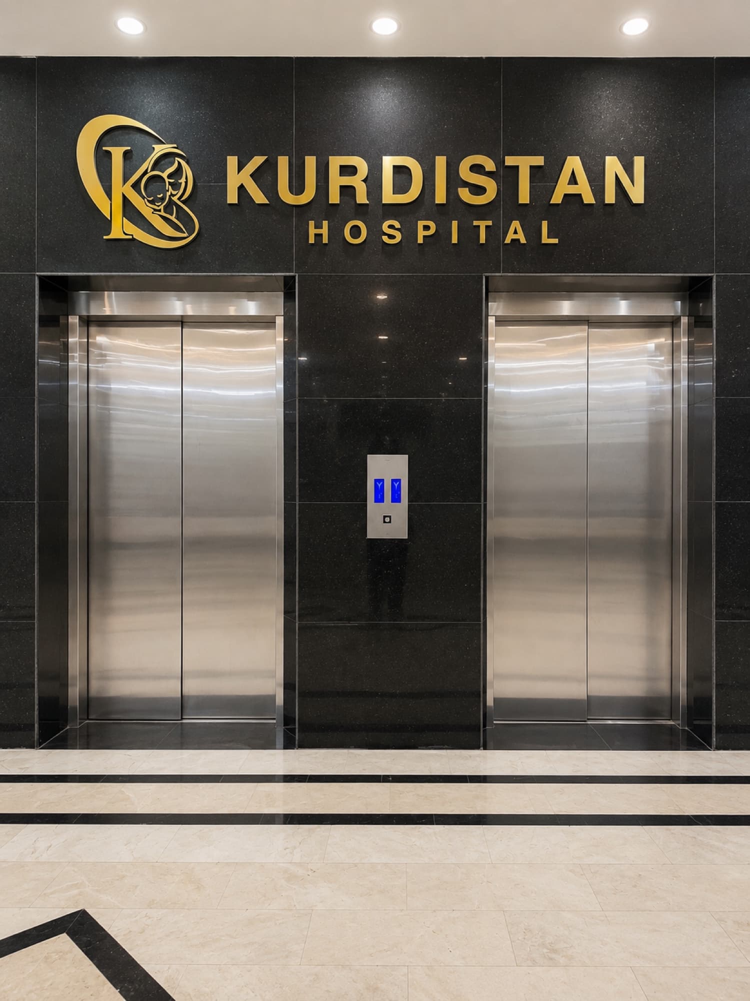 The elevator lobby with the Kurdistan Hospital branding